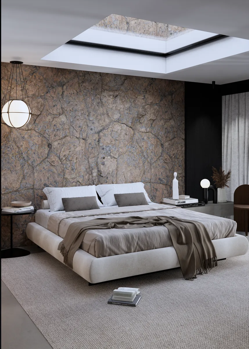 Quarto com parede de pedra, claraboia e cama baixa